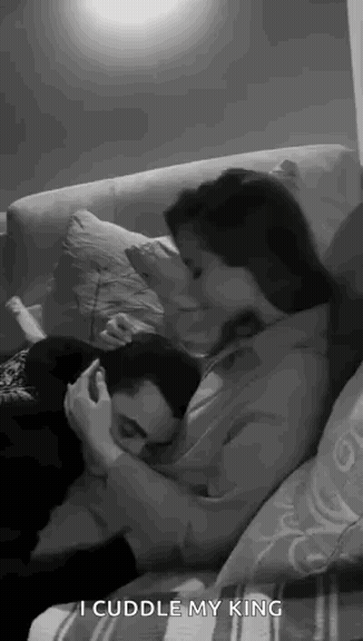 Man And Woman Hugging On Couch GIF