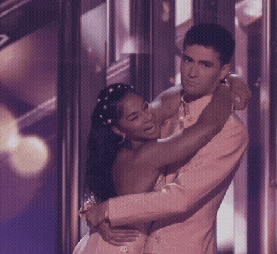 Man And Woman Hugging On Stage GIF