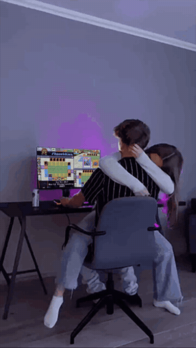 Man And Woman Hugging While Playing Video Game GIF