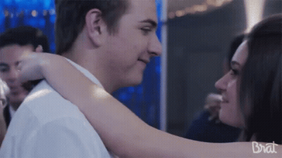 Man And Woman Hugging With Brat GIF