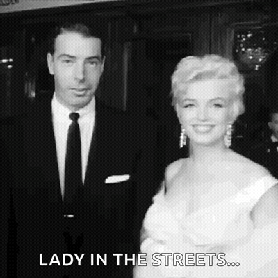Man And Woman In Black And White Standing Together GIF