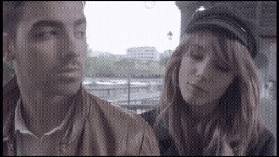 Man And Woman In Black Hat GIF