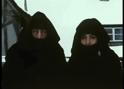 Man And Woman In Black Hooded Sweatshirts GIF