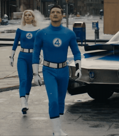 Man And Woman In Blue Fantastic Four Costumes GIF