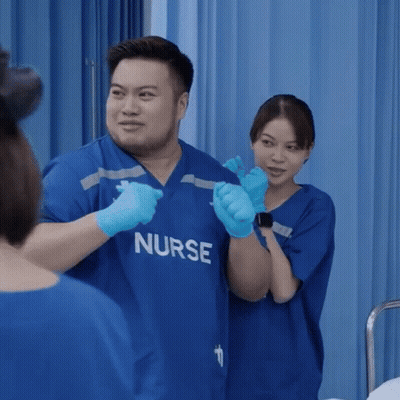 Man And Woman In Blue Nurse Scrubs GIF