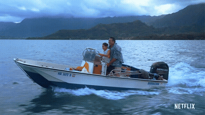 Man And Woman In Boat With Mercury Motor GIF