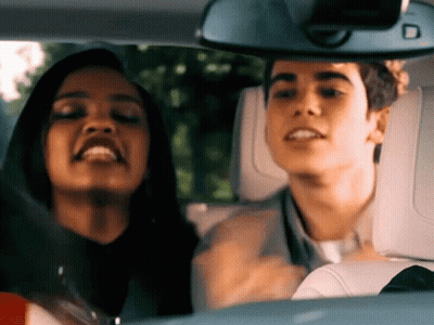 Man And Woman In Car With Mirror Showing D GIF
