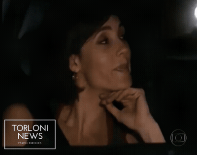 Man and Woman in Car With Torloni News