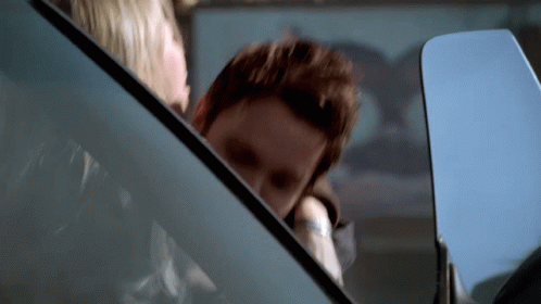 Man And Woman In Car With Woman Looking Out Window GIF