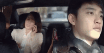 Man And Woman In Car Woman On Phone GIF