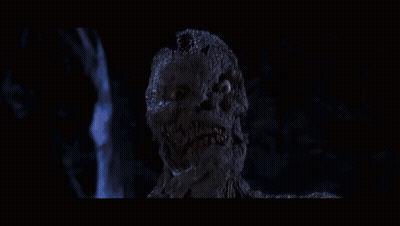 Man And Woman In Dark Room With Mummy GIF