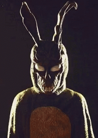Man And Woman In Dark Room With Rabbit Mask GIF