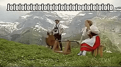 Man And Woman In Field With Jololololololololololololo Sign GIF