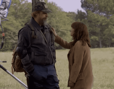 Man And Woman In Field Woman Touching Shoulder GIF