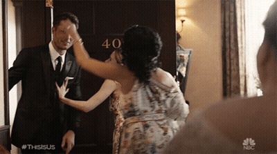 Man And Woman In Front Of 40 Door GIF