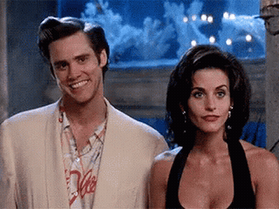 Man And Woman In Front Of Aquarium GIF