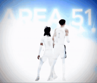 Man And Woman In Front Of Area 51 Sign GIF