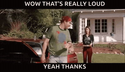Man And Woman In Front Of Car And House GIF
