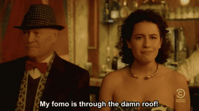 Man And Woman In Front Of Comedy Central Sign GIF