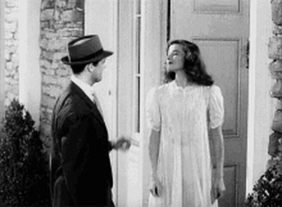 Man And Woman In Front Of Door GIF