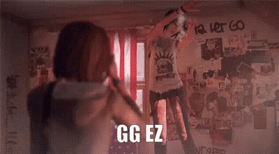 Man And Woman In Front Of Graffiti Wall Saying GG EZ GIF