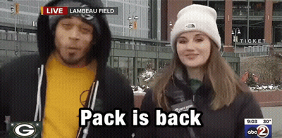 Man And Woman In Front Of Lambeau Field Saying Pack Is Back GIF