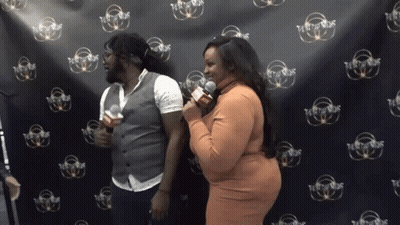 Man And Woman In Front Of Party Sounds Wall GIF