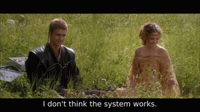 Man And Woman In Grassy Field Saying I Don't Think The System Works GIF