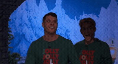 Man And Woman In Green Sweaters Saying Jolly Jolly Jolly GIF