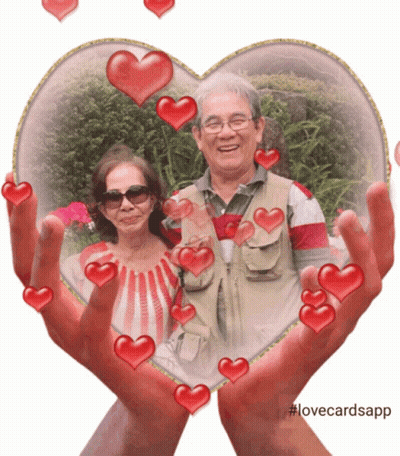 Man And Woman In Heart Frame With Hearts GIF