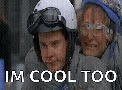 Man And Woman In Helmets And Goggles Hugging GIF