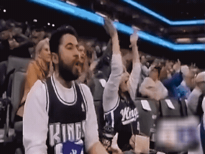 Man And Woman In Kings Jerseys Sitting In Crowd GIF