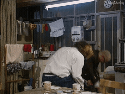 Man And Woman In Kitchen Saying Quicky Merky GIF