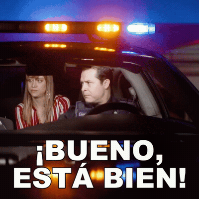 Man And Woman In Police Car Saying Bueno Esta Bien GIF