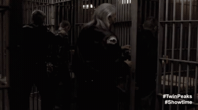 Man And Woman In Prison Cell GIF