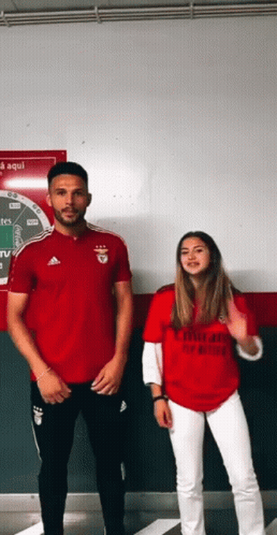 Man And Woman In Red Emirates Shirts GIF