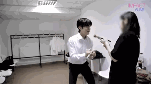 Man And Woman In Room With Imfact Alive Sticker