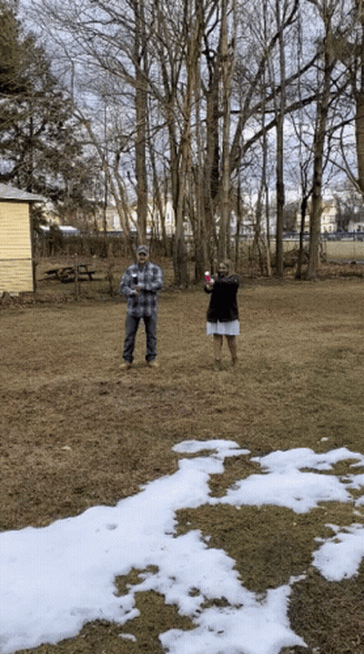 Man And Woman In Snowy Field GIF