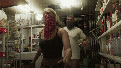 Man And Woman In Store With Piwasser Fin Sign GIF