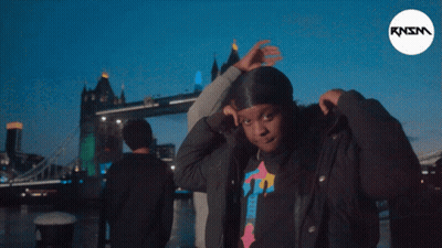 Man And Woman In Sunglasses And Hoodies Posing GIF