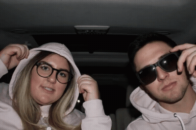 Man And Woman In Sunglasses And Hoodies GIF