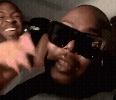 Man And Woman In Sunglasses Sitting Together GIF