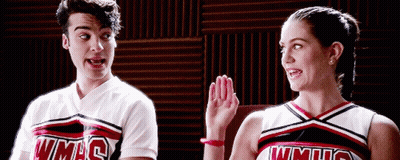 Man And Woman In WMHS Cheerleading Uniforms GIF