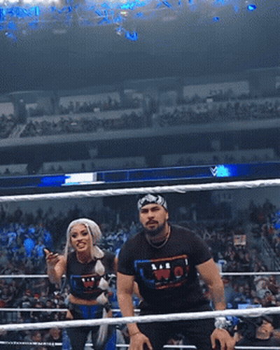 Man And Woman In Wrestling Ring, Shirt Says WP GIF