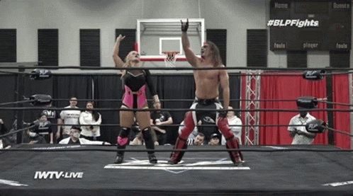 Man And Woman In Wrestling Ring Sponsored By IWTV GIF
