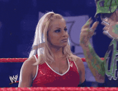 Man And Woman In Wrestling Ring With Letter W GIF