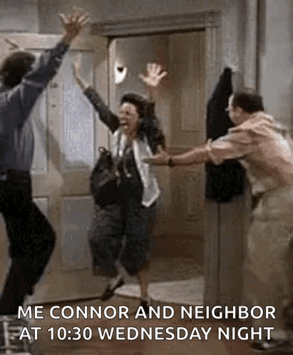 Man And Woman Jumping In Air In Front Of Door GIF