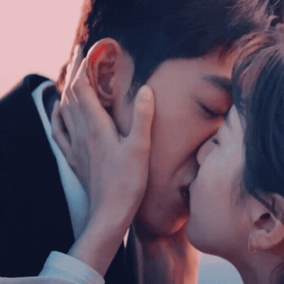 Man And Woman Kissing GIF