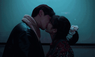 Man And Woman Kissing GIF