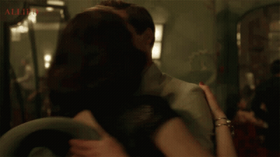 Man And Woman Kissing Allied GIF
